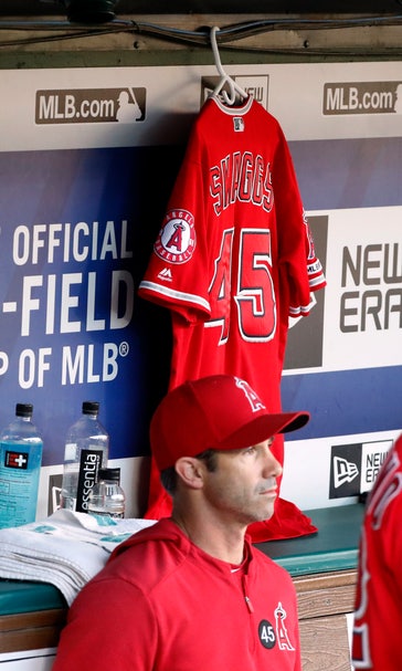 Grieving Angels beat Rangers 9-4 day after death of Skaggs